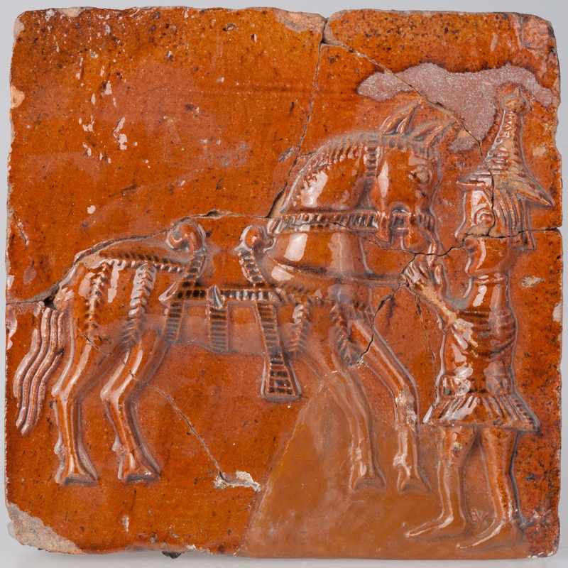 Kafel z postacią giermka trzymającego konia