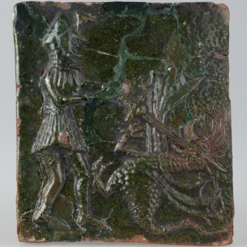 Kafel ze sceną walki rycerza ze smokiem